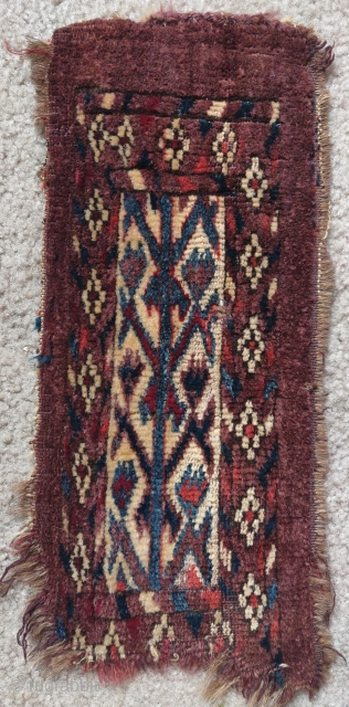 Yomut Turkmen igsalyk (spindle bag). Natural colors including cochineal with a distinctive purple-blue that is probably the result of an indigo and cochineal double dye. Evocative vegetal imagery against an ivory ground,  ...