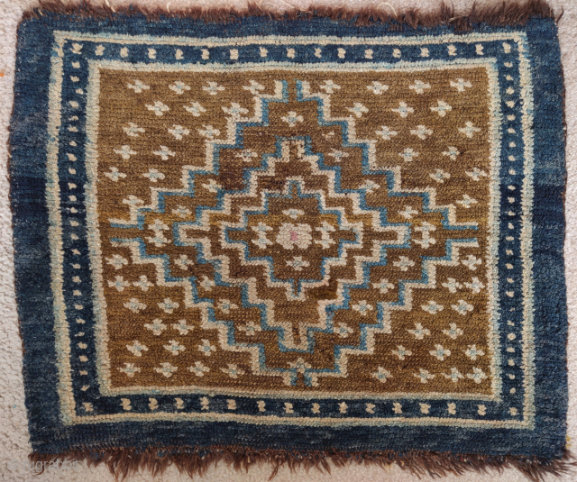 Tibetan square with a diamond design, 19th century, tie-dyed textile strip sewn onto back                   