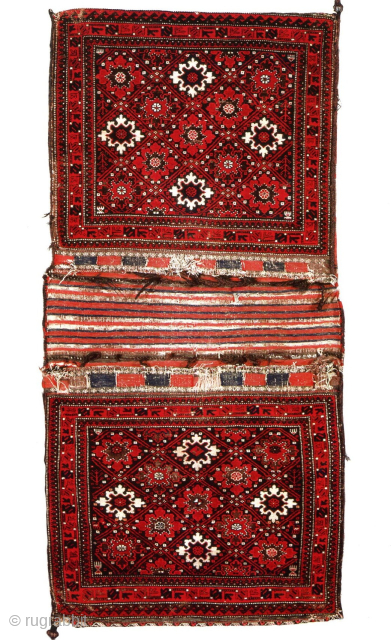 Complete Baluch khorjin set, snowflake / blossom design. One of the oldest complete Baluch saddle bags I've ever seen, if not the oldest.
Published as part of the Wisdom Collection, former George Gilmore
Super  ...