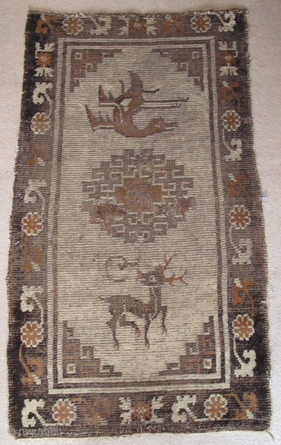 Mongolian Rug, Camel and Dark Brown un-dyed animal wool on a very light blue ground. (There is no white.) Warp is very thin reminiscent of imperial Ming carpets.) Wefting is thick brown  ...