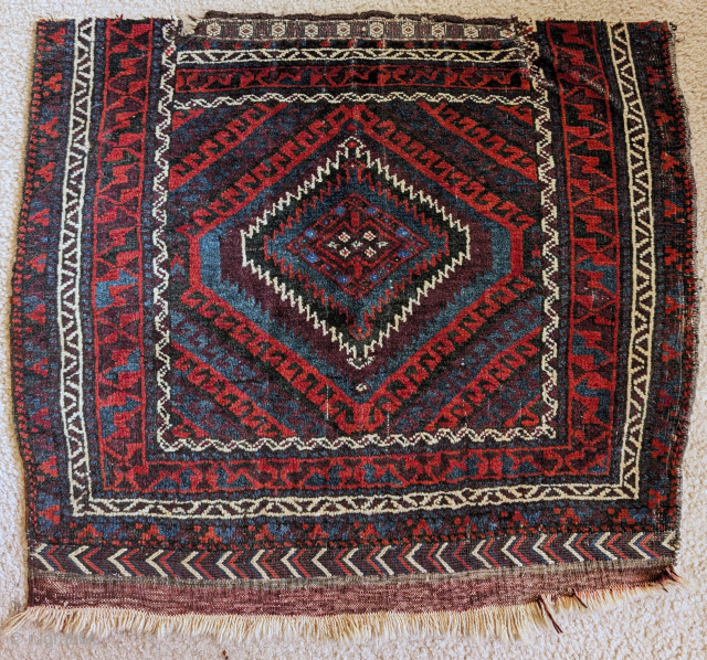 Baluch Sistan bag face with a Mushwani design. Full pile with sumak and kilim at the bottom end. Highlights in the center with an unusual light green/blue cotton? and cochineal. Former James ...