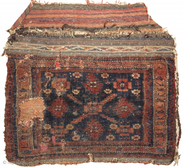 Single-wefted minakhani Baluch bag in paradoxical condition. An old example with several blues, complete back and great flat-woven top but with a lot of damage to the face. The pile face is  ...