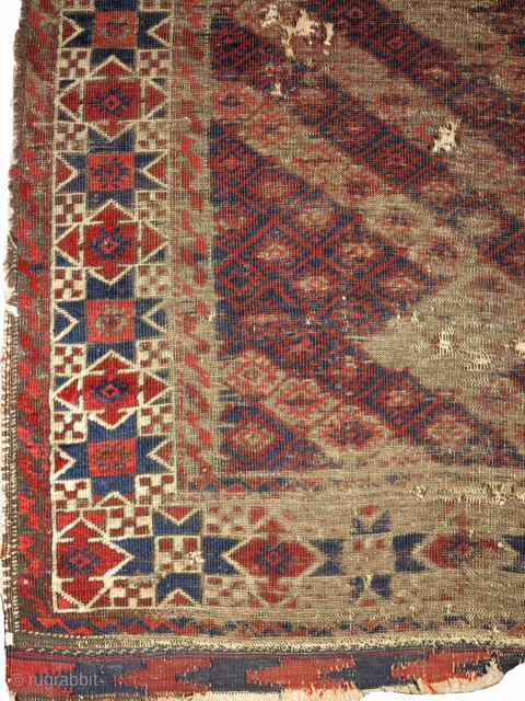 worn antique Khorosan Baluch rug with great star border. Diagonal stripes with a pile rendition of flatweave design. corrosive browns.


             