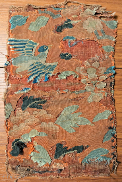Small fragment from a Chinese silk kesi
Probably part of the framed textile mounting of a Tibetan tanka China, 17th or 18th century

           