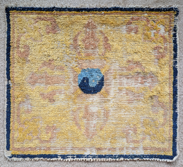 Ningxia seating square with a double dorje / tantric thunderbolt and central yin / yang symbol against an intense yellow ground. Commissioned for a Tibetan monastic patron.Likely 18th century    