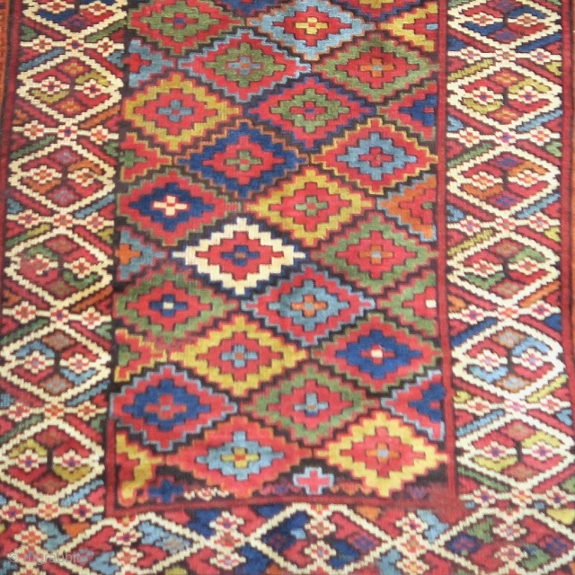 Remarkable colorful Sauj Bolagh Kurdish long rug with a step diamond field and fascinating border
                  
