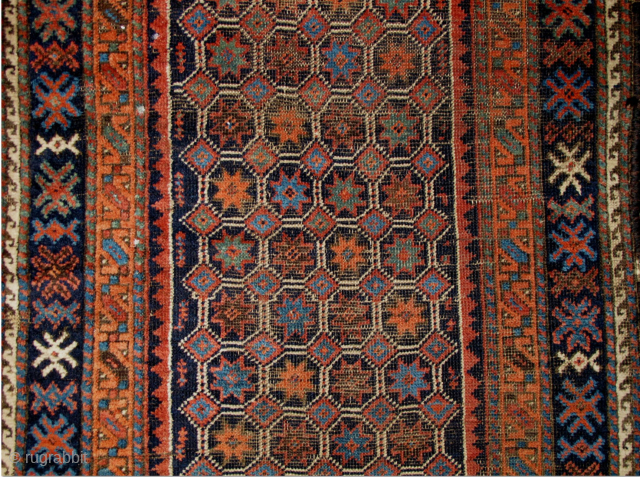 Baluch Runner, great natural colors, woven like a giant long bagface with a repeat mosaic like pattern of eight-pointed stars in a lattice. "Arab" type, open right, with corroded deep indigo almost  ...