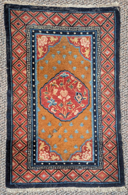 Small elegant antique Tibetan rug, all natural color with tone on tone reds                    