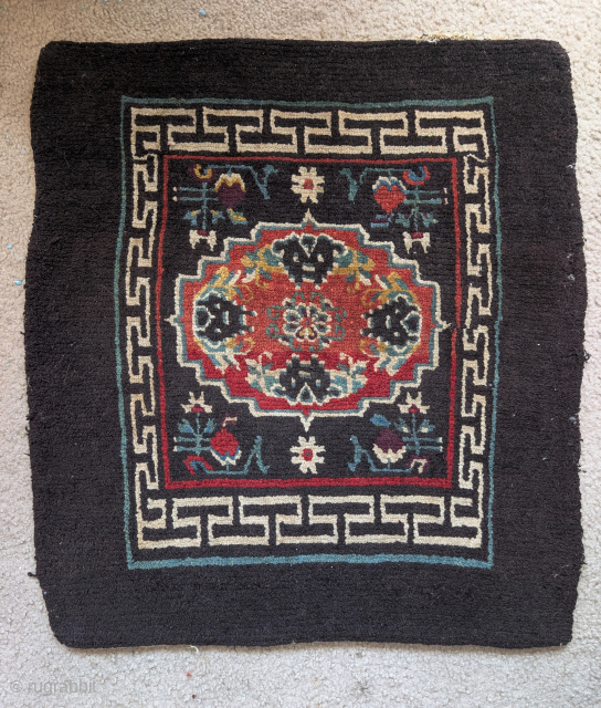 Antique Tibetan square mat on a black ground, all natural colors, fantastic Himalayan wool