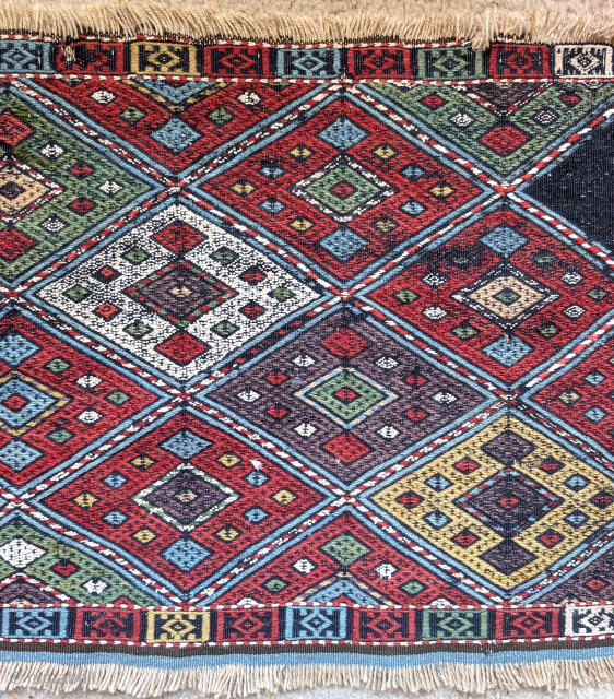 Flatwoven mafrash side panel, vivid natural color, deep aubergine, green, gold, peach and madder-red, cotton white. Some old reweave can be seen in the back image. One diamond.