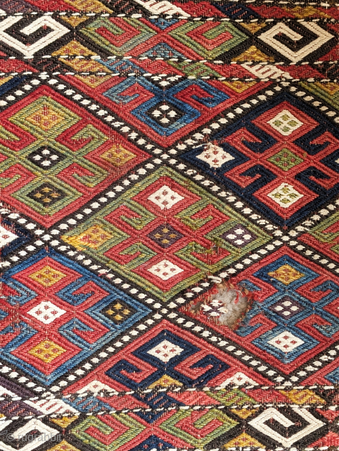 Colorful flatwoven mafrash panel, several blues, aubergine, green, gold, and cotton white