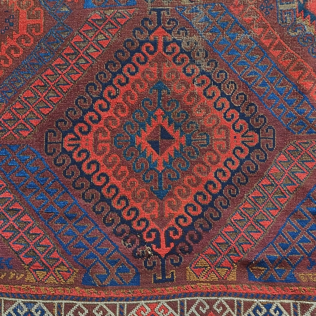 Symmetrically knotted Baluch rug with a Mushwani type diamond design. Some wear and old attempts at restoration. Dynamic and fun with nice natural color. 3'8"x6'10"        