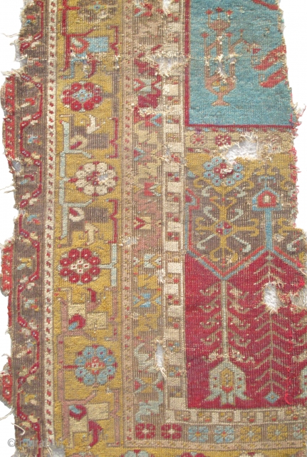 Ladik Prayer Rug, late 18th century, severely fragmented in two sections, dynamic drawing with many stylized ewers, very dirty and damaged but with a vibrant and uncommon gold border, recently found in  ...