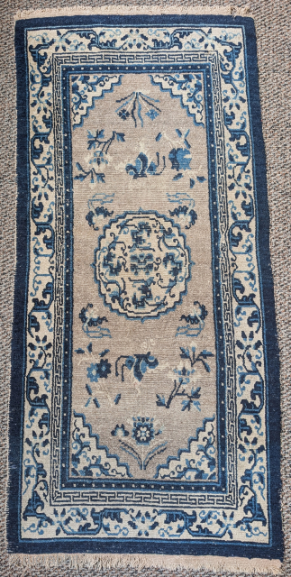 Antique Tibetan rug with a speckled natural oatmeal-colored ground. The format and drawing are based on Ningxia rugs of the 19th century. Very pleasing piece. 2'6"x5'4"
       