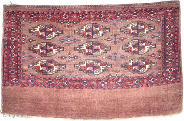 Turkmen chuval. Mostly asymmetrically knotted open left, but with some bands of symmetrical knots in the lower border. Dark wefts, unusual palette. Looks very Yomut but some would call it ''Eagle Group  ...