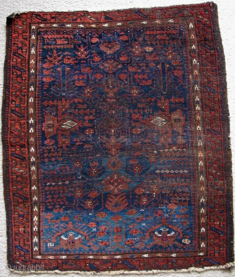 Baluch balisht from northeast Persia, fine weave and lots of different blues and greens, dynamic drawing of the tree and accompanying repertoire of ornament. The  bottom is thicker than the top  ...