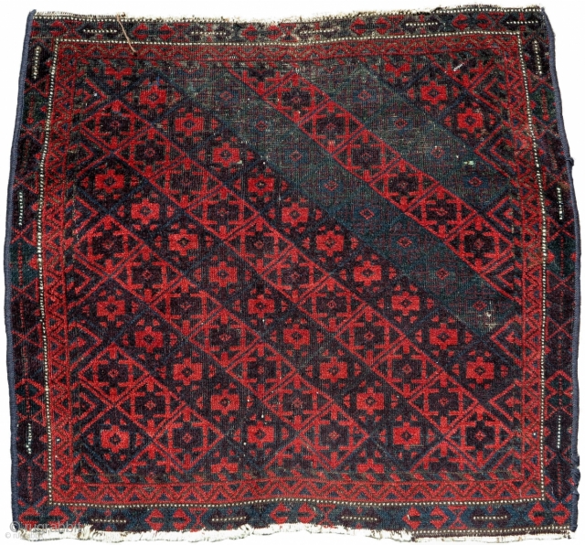 Large Sistan Baluch khorjin (bagface). Very graphic with saturated natural dyes including aubergine and several green-blue hues.
                