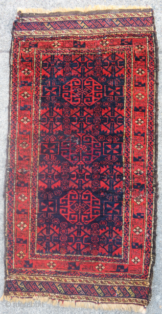 Baluch balisht with radiant reds and glossy wool. Silk highlights in the flatwoven ends. Cochineal used as abrash in the central geometric ornament.          