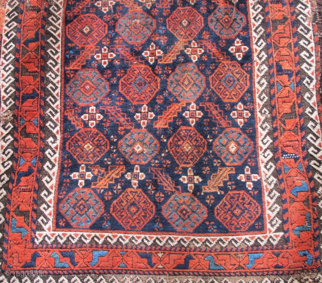 Arab? Baluch Rug . asymmetrical knot open right but with 4-chord goat selvedge. Running dog minor borders and other features of Khorossan minakhani Baluchis of the depressed warp type but without the  ...