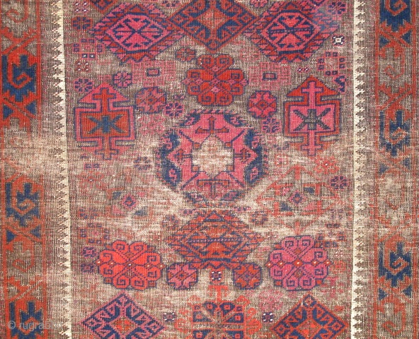 Khorosan Baluch rug, with corroded brown ground and design elements often associated with Timuri type weavings. Very intriguing central element. Lots of cochineal and madder.        
