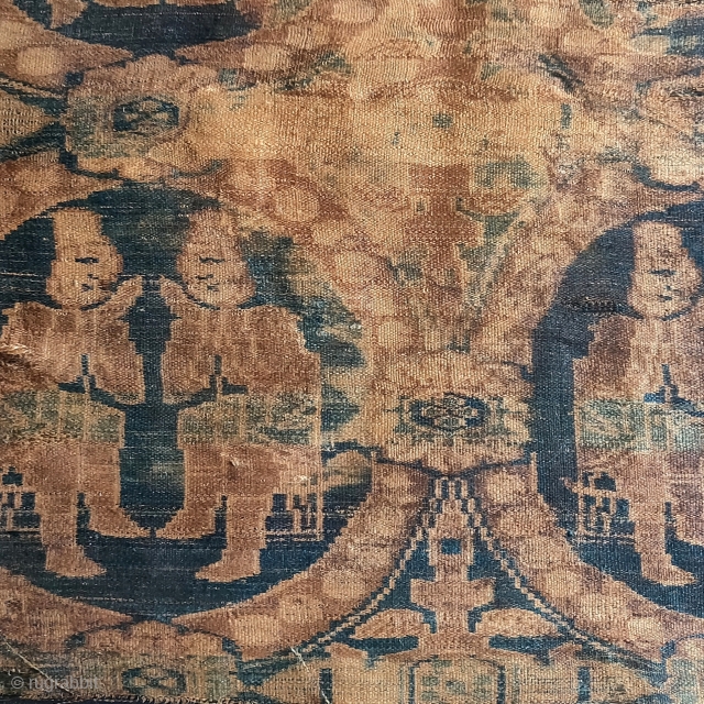 6th- 7th century silk warp-faced textile fragment in the 'International Style' depicting seated Central Asian or Iranian merchants within roundels ornamented with pearls. 
 This warp-faced structure pre-dates the weft-faced samite silks  ...