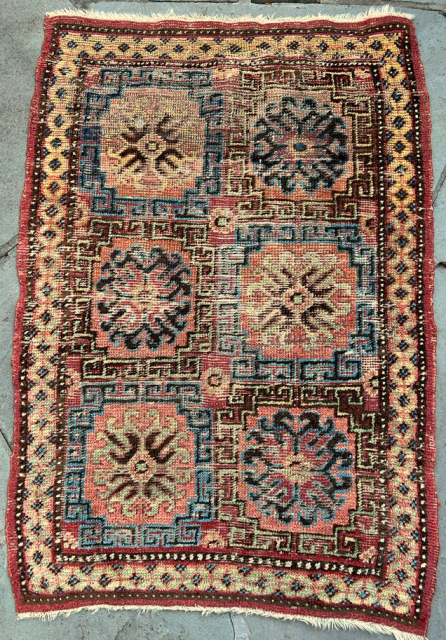 Small Khotan rug, good colors, areas of restoration                         