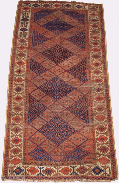 Baluch border-changing rug. Perhaps the weaver was just feeling playful? An elegant rug in very presentable condition. Well balanced drawing, subtle abrash with three blues. This rug was published in Basha's rather  ...