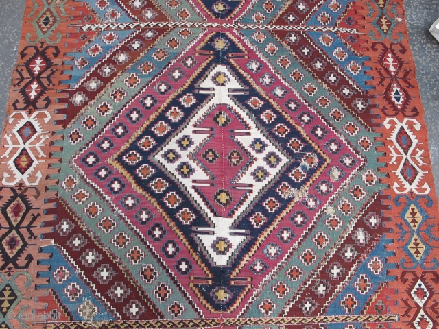 Very long antique Reyhanli kilim from Eastern Anatolia. Older than most with a very good color range and saturation including a great ox-blood maroon, two greens two oranges, at least three blues,  ...