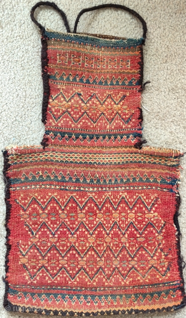 Baluch double-sided flatwoven salt bag, tribal region, Northwest frontier, an old one with great color and execution, old repair in one side at the edge of the neck which itself is probably  ...