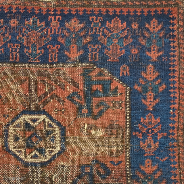 Baluch star bag with polychromatic blue, a blue-green, and copper / cinnamon ground. Older than most but worn.1 knot of cotton in lower right-center of field.excellent handle.      