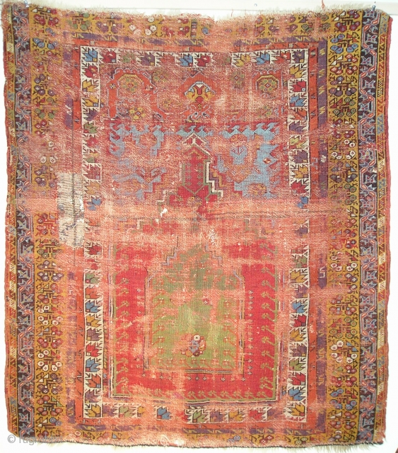 Smashed but Fantastic Anatolian Prayer Rug. Mudjur / Kirshehir type with super-saturated colors including vibrant red and blue, true aubergine, two greens orange and golden yellow. The border system represents familiar elements  ...