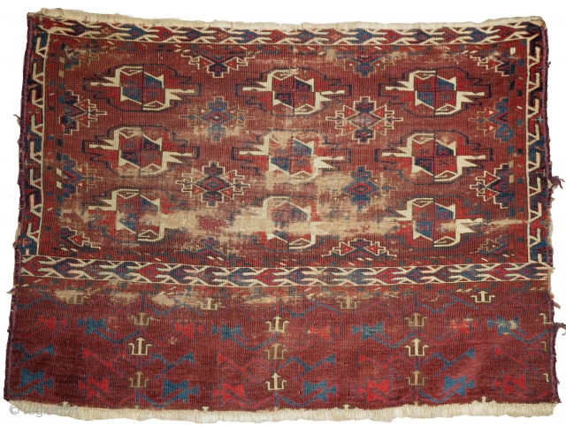 Turkmen Yomut Chuval, worn but much more interesting than most of the type. fine weave, precision detailing and great color saturation. Very interesting things happening within the negative space, especially within the  ...