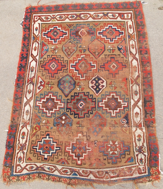 Northwest Persian Rug, Kurdish or maybe Shahsevan? Memling gul design on camel ground with great colors. The whites towards the bottom are cotton. The piece is cut and shut but the resulting  ...