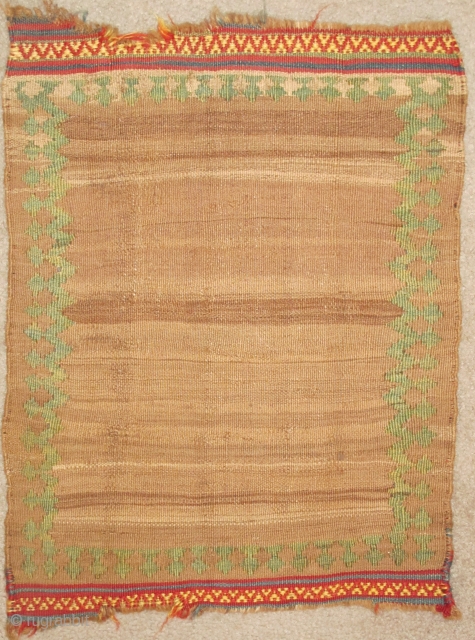 Miniature Minimalist South Persian Kilim with a natural abrashed camel ground and pistachio green border. Perhaps a small sofreh, cover or bread cloth. There are remains of knotted warps on either end  ...