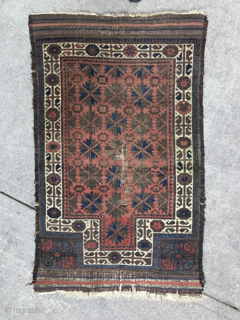 A highly unusual red ground Baluch prayer rug, Symmetrical knotted. 
3’.3” x 2’.6” Circa 1880
Highly depressed wraps. All vegetable dyes. 
Original side finish with goat hair. 
Woven upside down. 
Not washed or  ...