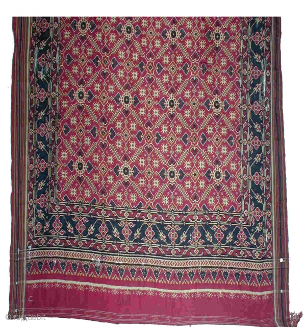 Patola Sari (double Ikat)
112x440cm
Patan, Gujarat, India)
19th century
Silk
 Because the sari has been worn a lot and had some holes, it was professionally mounted on a thin red cotton cloth.
The colours are very  ...