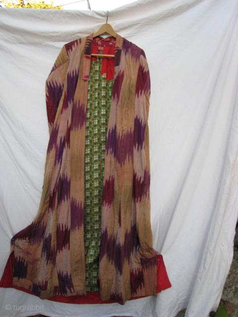 Uzbek Ikat Chapan, lined with cotton, lightly quilted at neck.  Afghan style, with non-functional sleeves sewn together with embroidered cloth in back.          