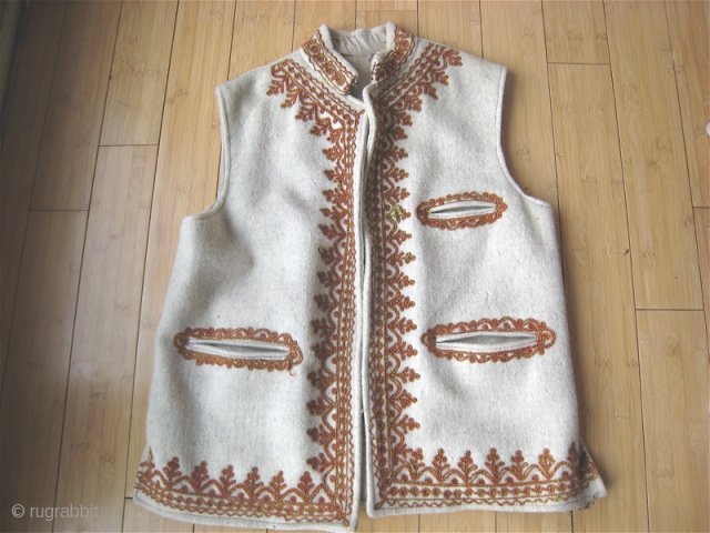 Wool vest from Swat Pakistan.  Hand-woven wool, traditional embroidery with silk thread.  Suitable for man or woman.  39 inches around chest, 26 inches long.  Some small moth damage.  ...