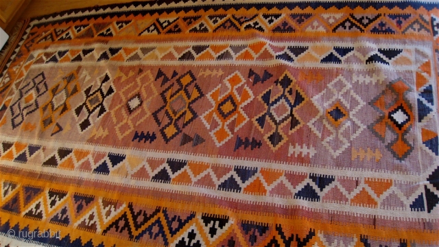 Afghan kilim, purchased in Peshawar 1989.  64 inches by 109 inches.  Fringe worn, one inch square raveling spot.  Bright orange, cream and dark blue-black.  All wool.  Age  ...