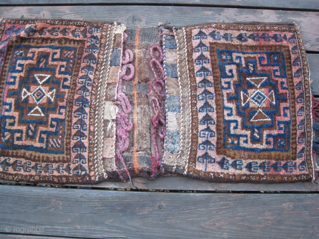 Baluch saddle bag.  Pile front, flat weave back.  Fringes worn, mostly missing.  20 x 40 inches.              