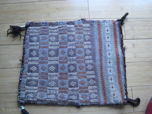 Afghan Baluch salt bag, flat weave, vegetable dye and natural wool colors.  Glass beads on fringe.  16 x 13 inches.           