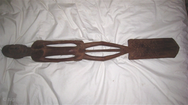 Asmat (West Papua) dark wood carving with shovel-shaped base.  Male/female figure on the handle.  37 inches long, 5 inches wide, 5 inches deep.  Purchased in Irian Jaya Indonesia in  ...