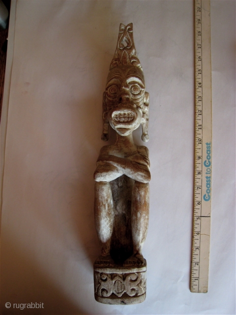 Borneo:  Hand carved figure from East Kalimantan, Indonesian  purchased in 1977.  bleached wood.  15 inches high.             
