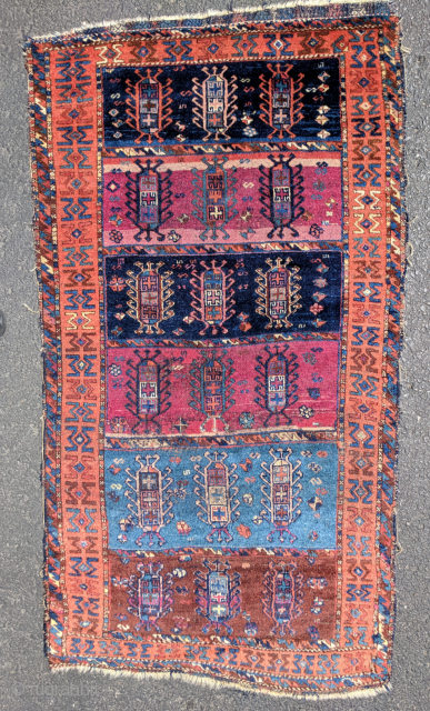 East Anatolian small rug 5'5" by 2'11". Minor lossees to the edges, small area of re-piling visible in the detail slide. This piece has ann old back, possibly early 19th century.  