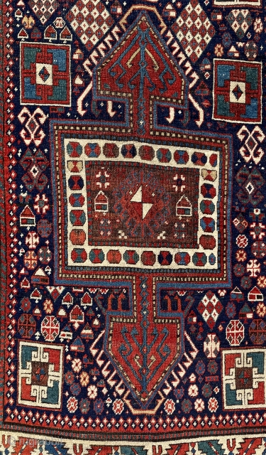 Eastern or southeastern Caucasus.  118” x 43” (301 cm x 1090 cm).  Older runner (mid 19th ?), with unusual design of large 3-lobed medallions.  Lots of other filler elements,  ...