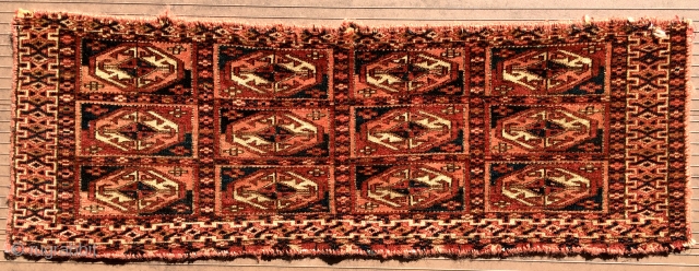 TEKKE TURKMEN MAFRASH WITH OCTAGONAL GULS. 31” X 10.5” (79 cm x 27 cm). 19th C. Edges are not complete and are overcast with red yarn (beginning to separate in a couple  ...