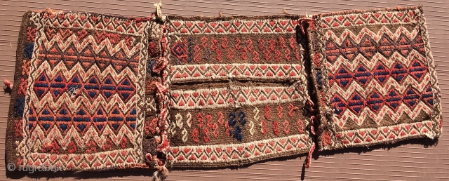 Turkish heybe or small double bag with a long slot in the bridge area to put the head through so it can be worn hanging over the shoulders with the bags front  ...