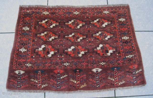 Fine 19th century Yomud group chuval ,or maybe Arabachi? in excellent condition, full pile, no damages and all natural colors. The piece shows in a violet-brown groundcolor nine magnificent orange-white chuval guls  ...