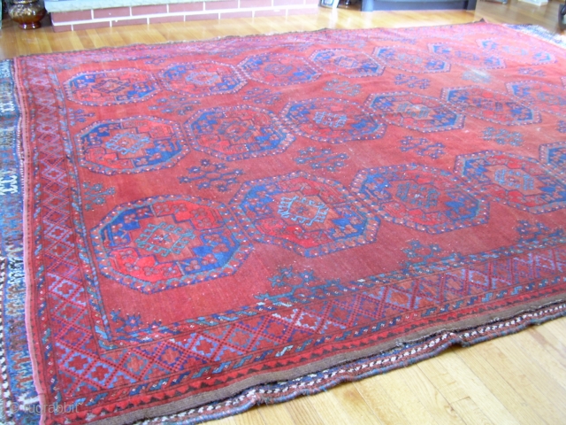 7'4" x 9'6" old ersari rug, with some nice open space and colors, but also a second red that's not all natural, some wear areas, and one 4" x 1.5" little cut  ...