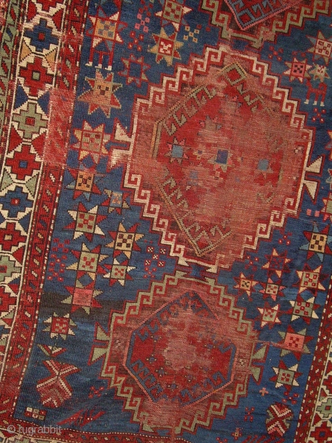 caucasian rug, 3' 6" x 5' 10" ... some nice color and drawing foundation mostly there.  one redorange looks whitish on back?  lots stars, one with legs.  $200 by  ...